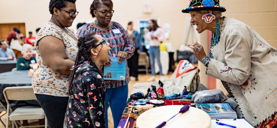 Charlotte storyteller Ramona Moore Big Eagle (right) engages residents at a Culture Blocks event.